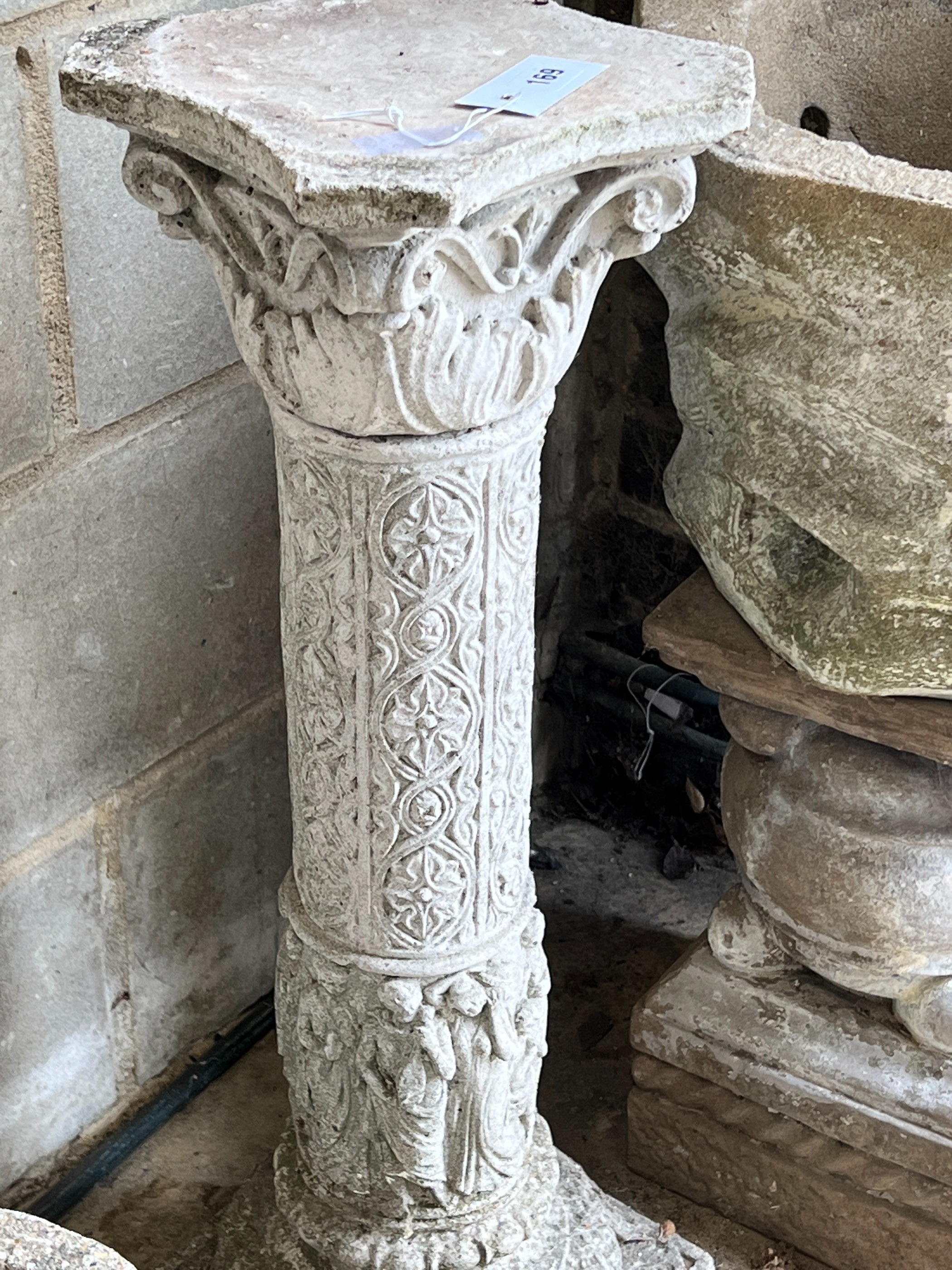 A garden planter on associated plinth, a garden column and two circular garden planters